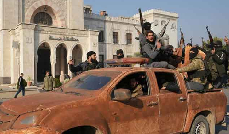 Syrian rebels seize fourth city, close in on Homs in threat to Assad’s rule